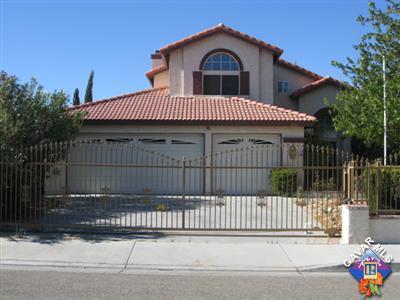 a front view of a house with a fence