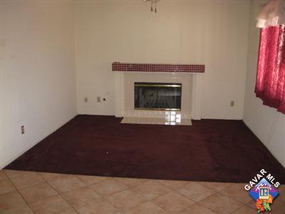 3201 Shale Road Palmdale, CA 93550 - Photo 3 of 7 a room with a bed and a fireplace