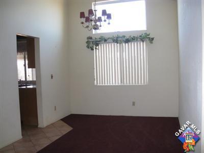 3201 Shale Road Palmdale, CA 93550 - Photo 6 of 7 an empty room with wooden floor and windows