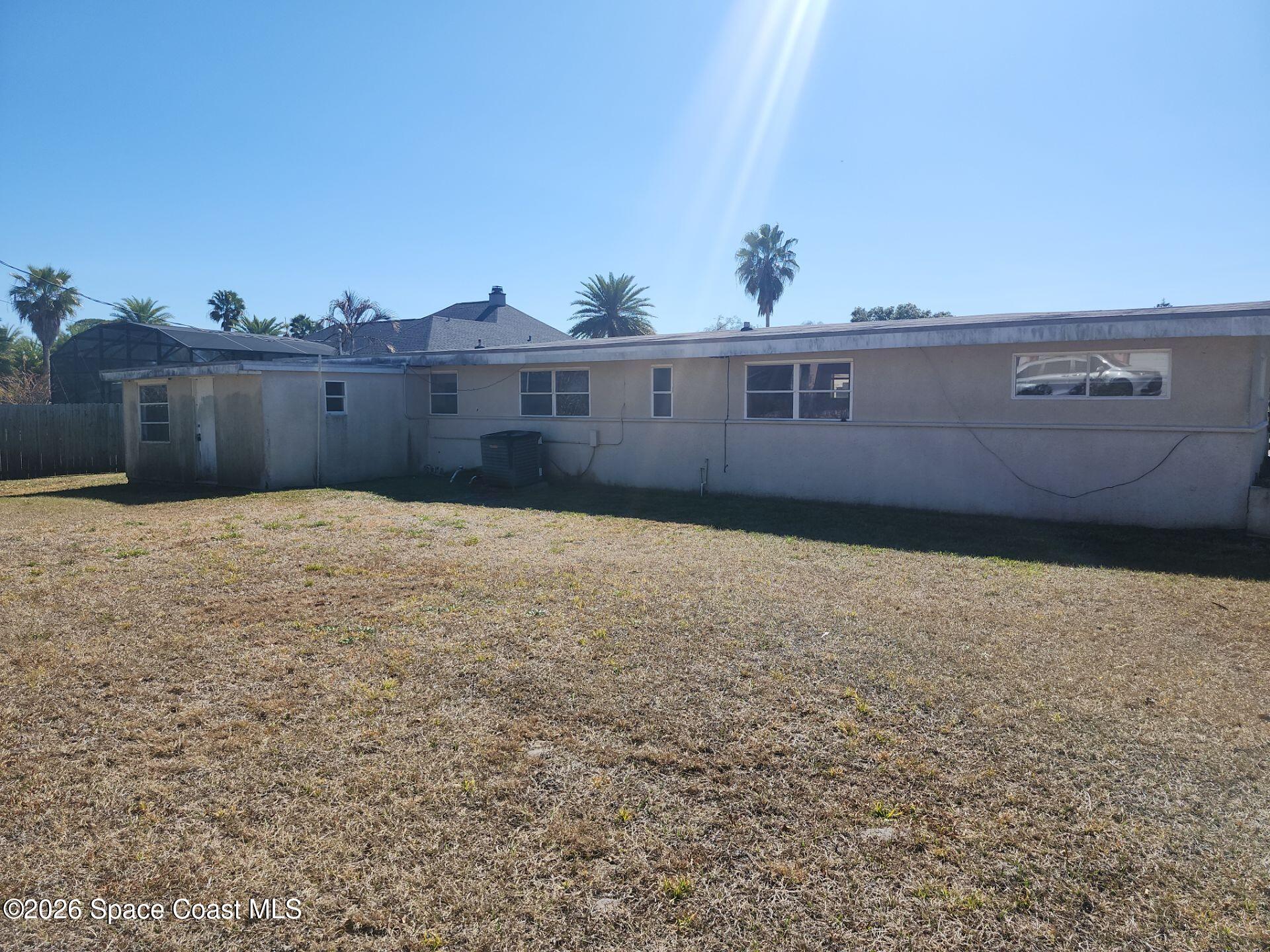 180 Church Road Merritt Island, FL 32953 - Photo 14 of 14 a view of a big house with a yard