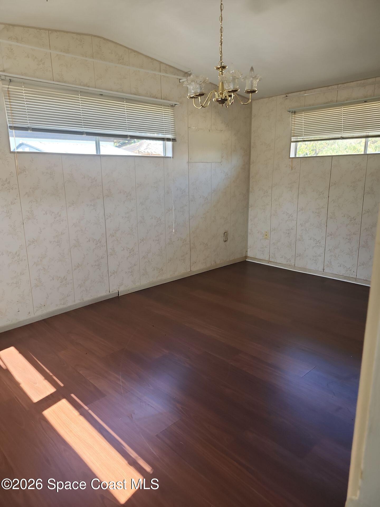 180 Church Road Merritt Island, FL 32953 - Photo 10 of 14 a view of a room with wooden floor