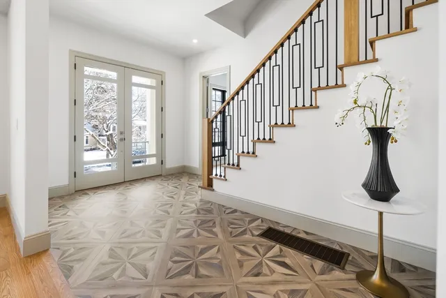 a view of an entryway with wooden floor