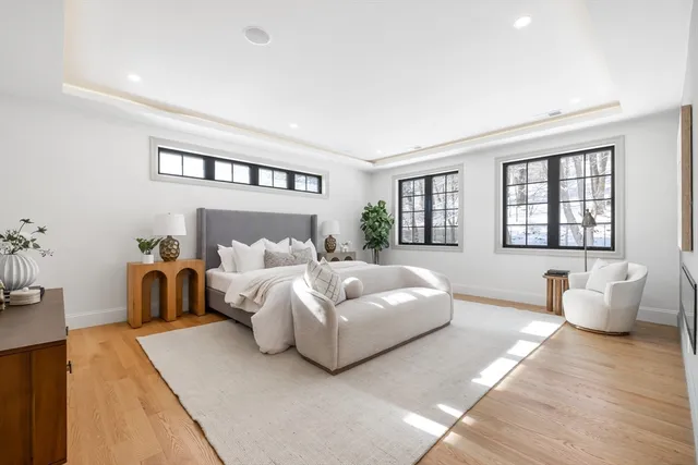 a bedroom with a large bed and a couch