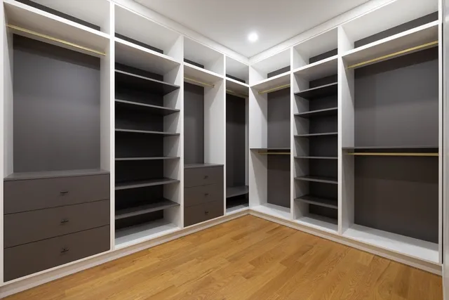 a view of an empty room with empty shelves