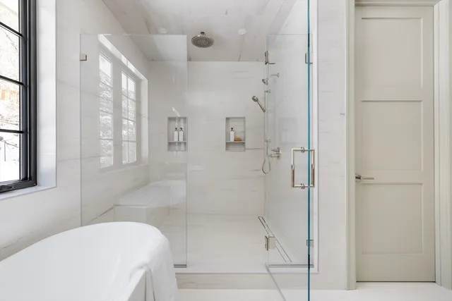 a bathroom with a shower and bathtub