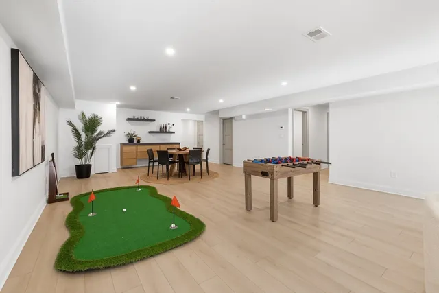 a living room with furniture and a table