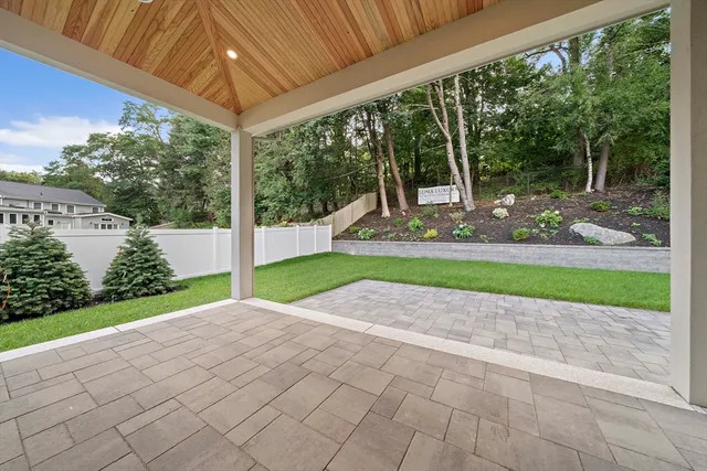 a view of a patio with a garden