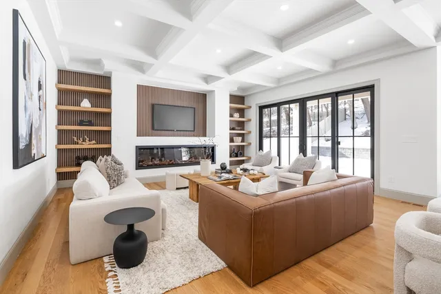 a living room with furniture fireplace and a flat screen tv