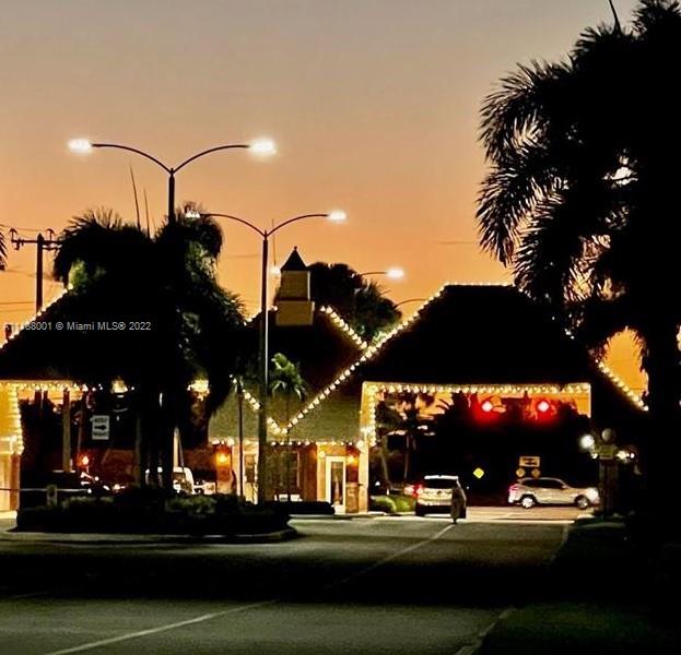 36 Suffolk A, Unit 36 Boca Raton, FL 33434 - Photo 1 of 1 a view of street with lots of cars parked on the road
