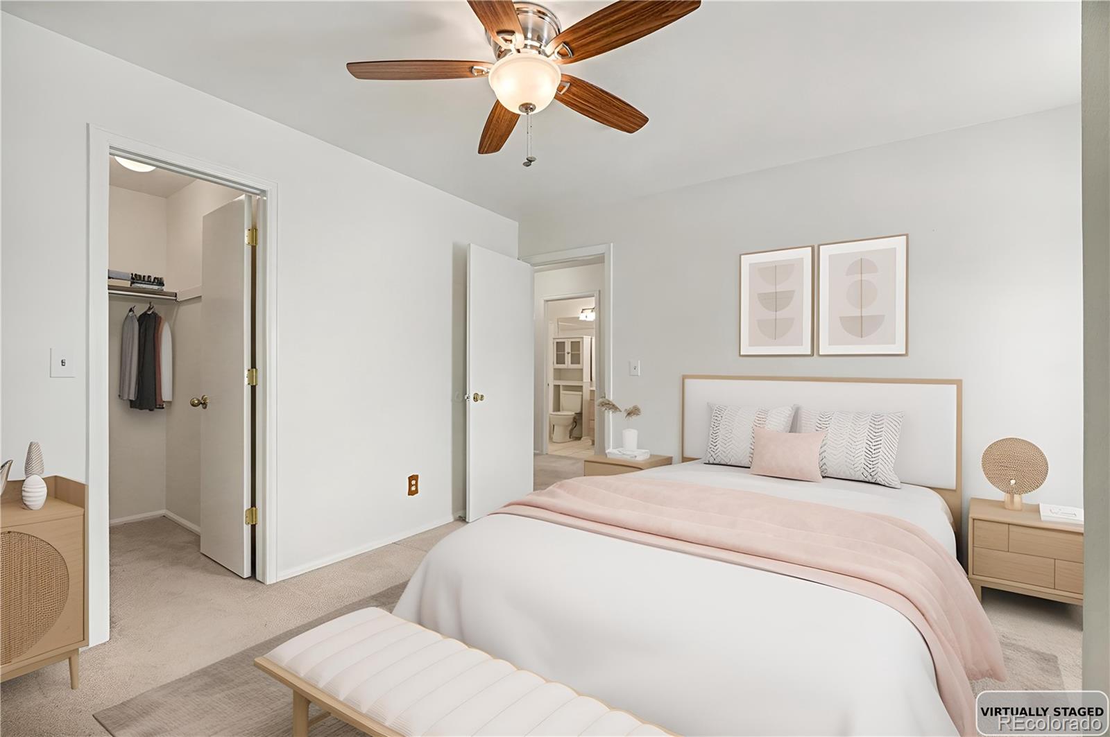 5257 Estes Circle Arvada, CO 80002 - Photo 18 of 22 a bedroom with a bed and a chandelier