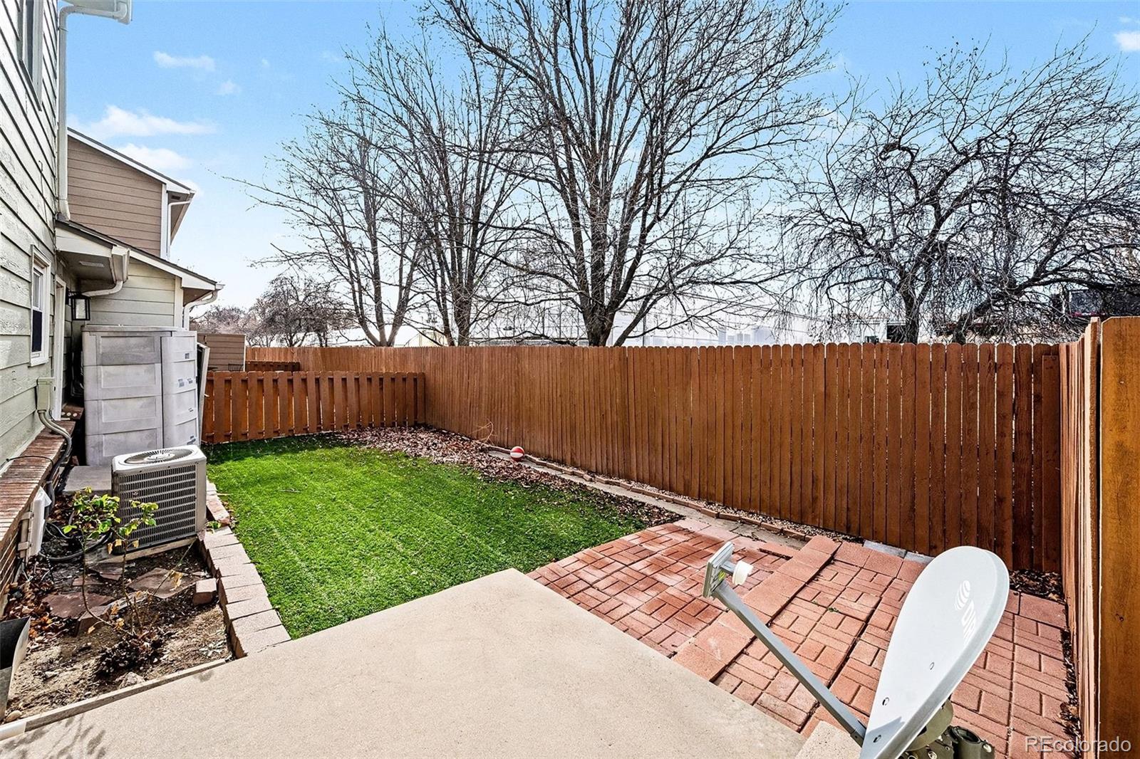 5257 Estes Circle Arvada, CO 80002 - Photo 20 of 22 a view of a backyard with wooden fence