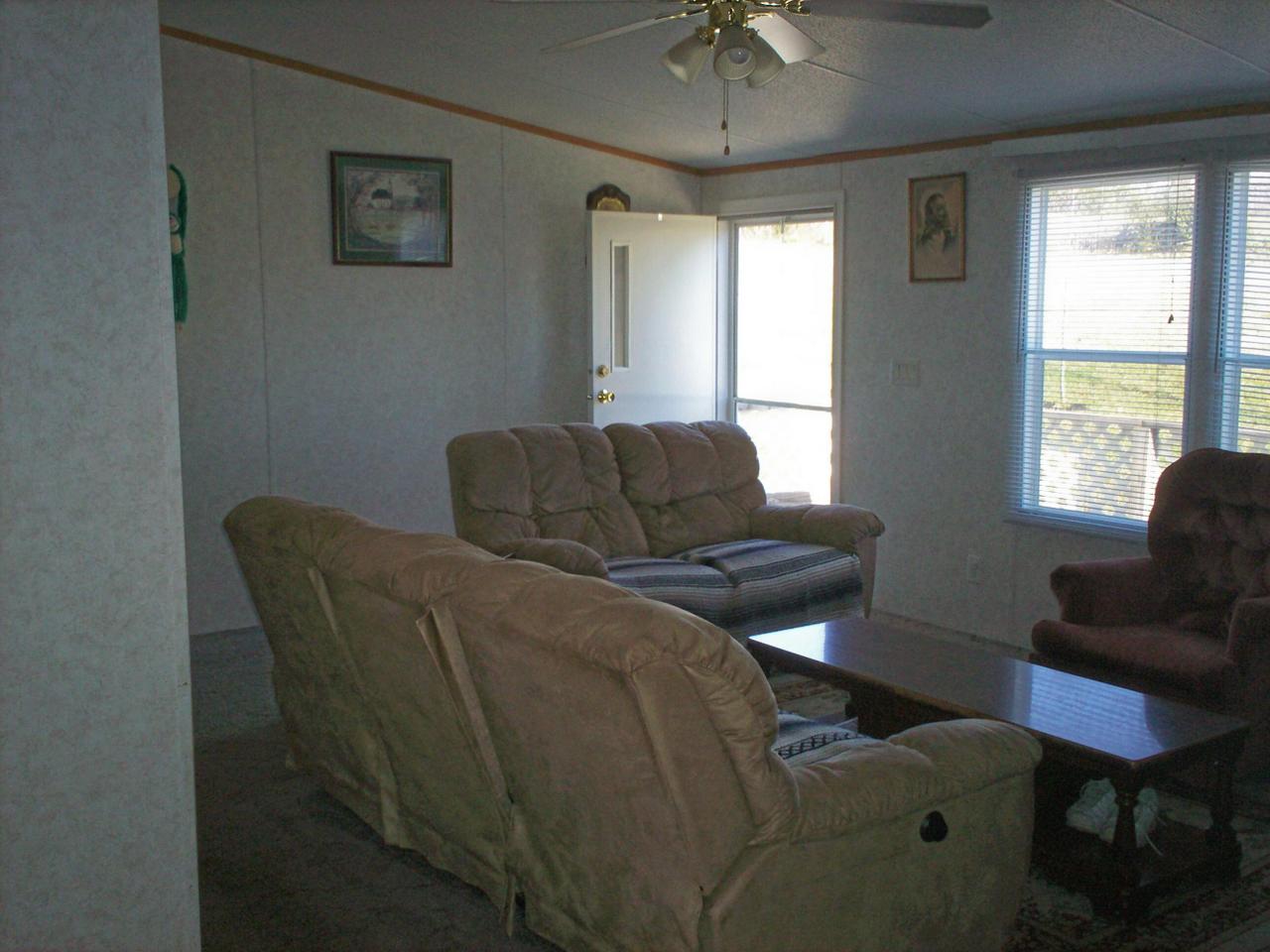 1775 Harmony School Road Hardy, VA 24101 - Photo 2 of 8 a living room with furniture and a window