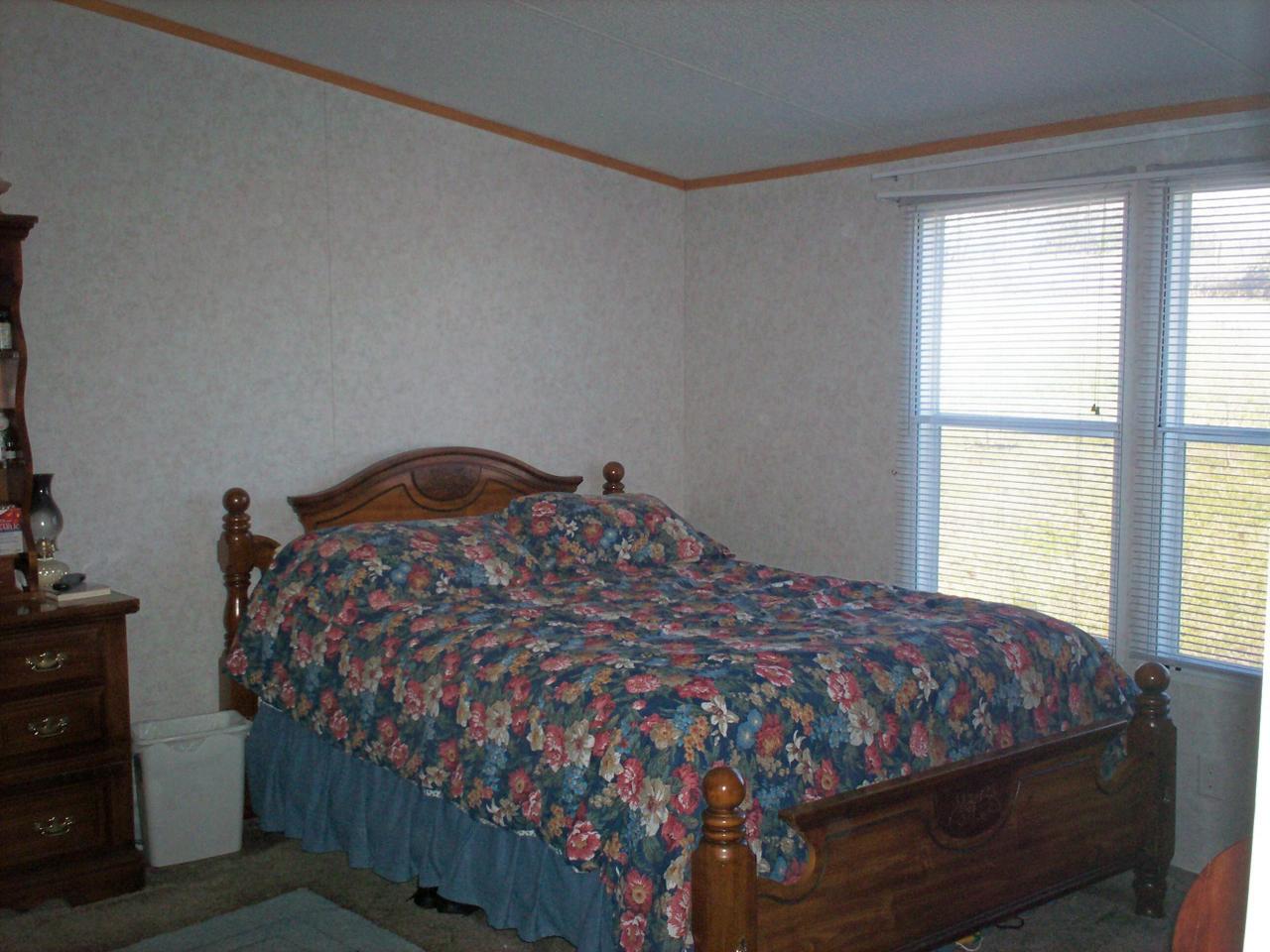 1775 Harmony School Road Hardy, VA 24101 - Photo 6 of 8 a bedroom with a bed and a window