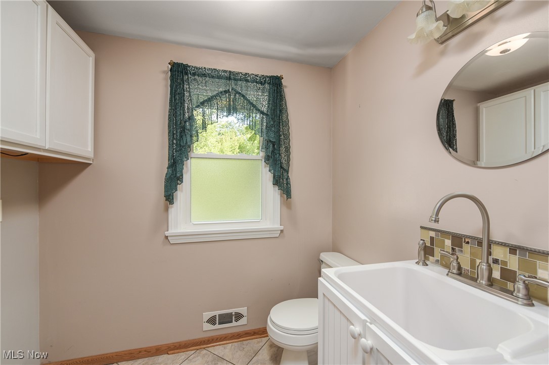 137 Armour Road Avon Lake, OH 44012 - Photo 23 of 50 1st floor laundry and half bath