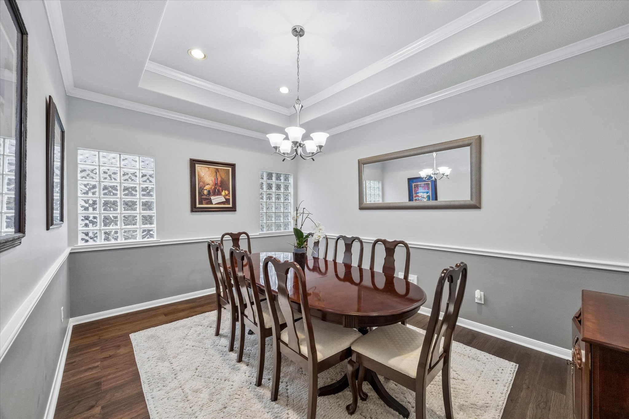 12423 Rutgers Park Court Houston, TX 77058 - Photo 8 of 29 a view of a dining room with furniture a chandelier and wooden floor