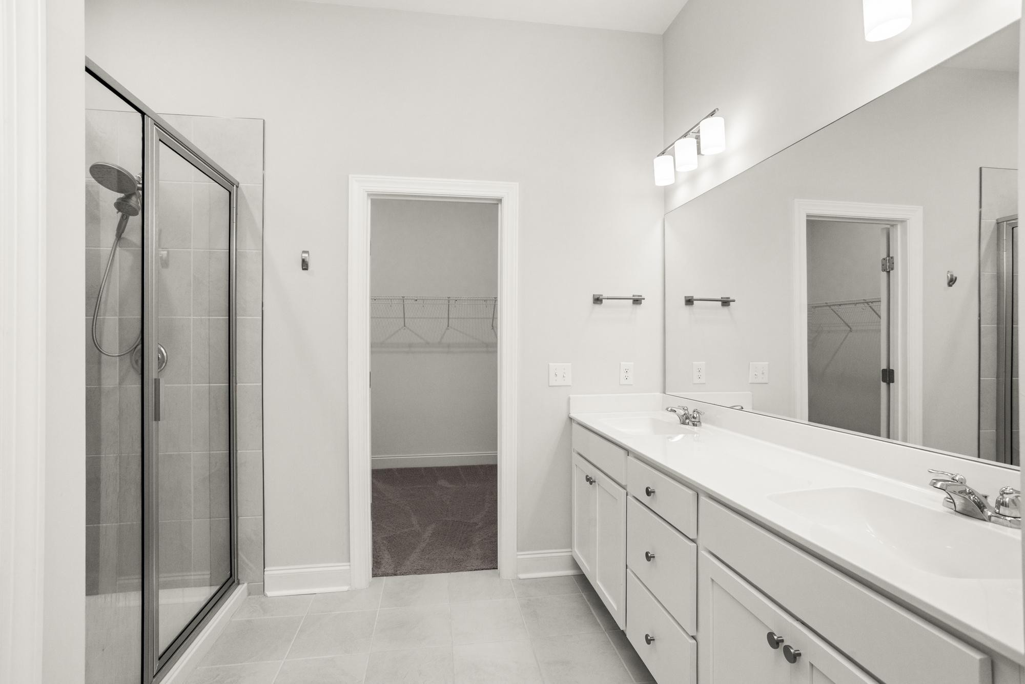 3706 Apies Street Murfreesboro, TN 37129 - Photo 23 of 42 a spacious bathroom with a double vanity sink a mirror and a shower