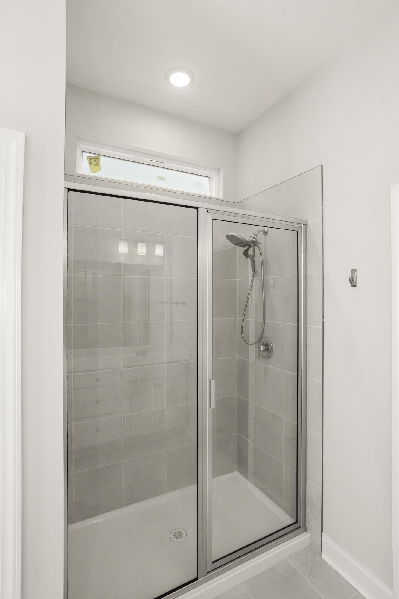 3706 Apies Street Murfreesboro, TN 37129 - Photo 25 of 42 a bathroom with a glass shower door