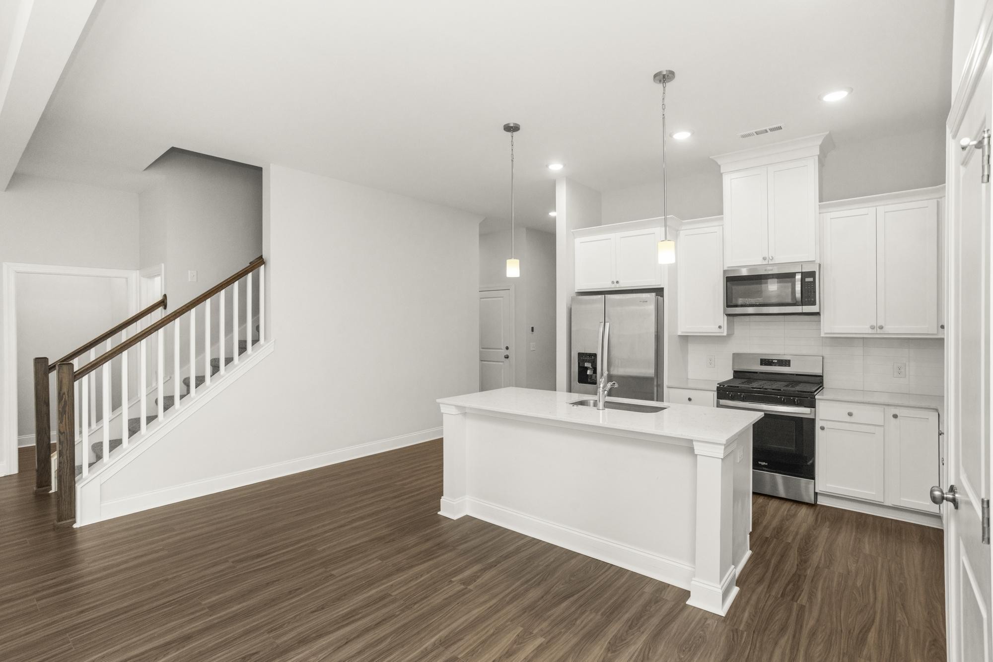 3706 Apies Street Murfreesboro, TN 37129 - Photo 8 of 42 a kitchen with stainless steel appliances kitchen island a stove a sink and a refrigerator