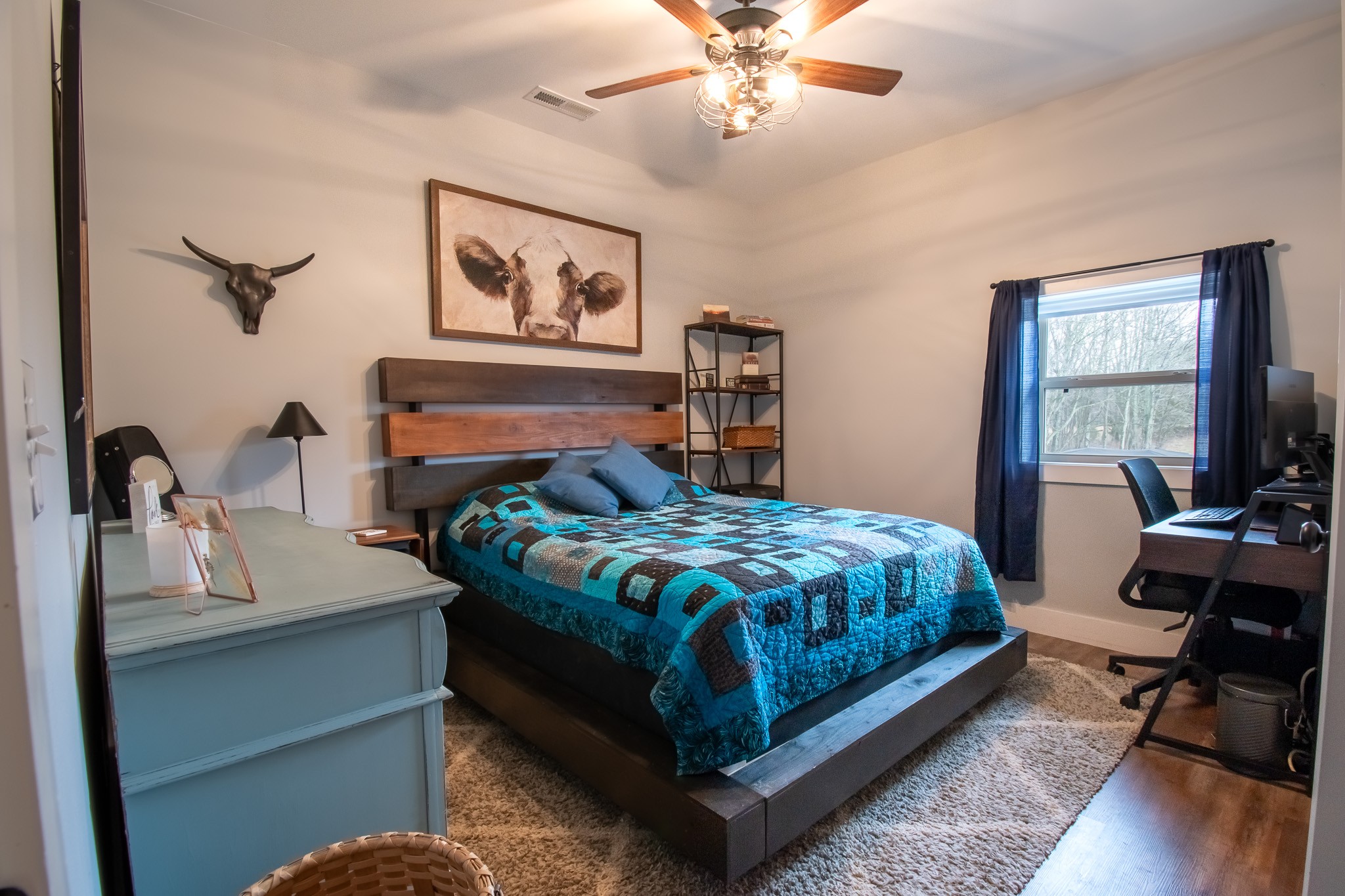 6490 Prospect Road Prospect, TN 38477 - Photo 24 of 52 a bedroom with a bed and a chandelier