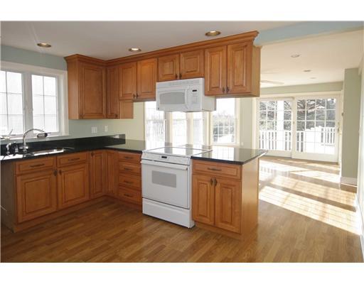 40 Ridgeley Street Darien, CT 06820 - Photo 3 of 15 a kitchen with granite countertop white cabinets and white appliances