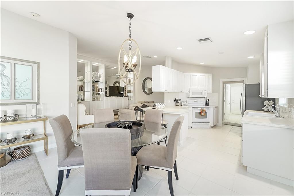 7767 Ionio Court Naples, FL 34114 - Photo 12 of 41 dining area kitchen adjacent