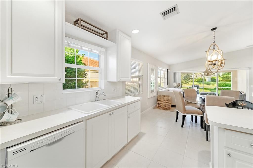 7767 Ionio Court Naples, FL 34114 - Photo 14 of 41 white and bright kitchen