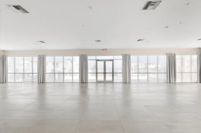 a room with a window and a kitchen