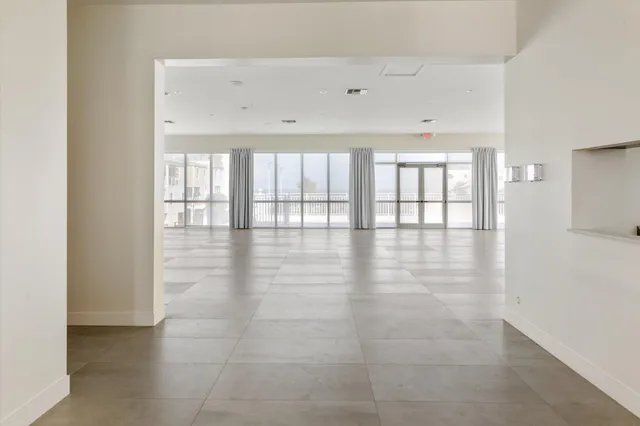 a room with lots of table and chairs