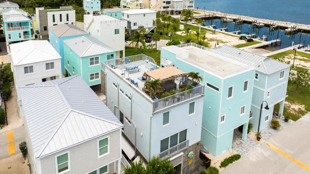 an aerial view of residential houses with outdoor space