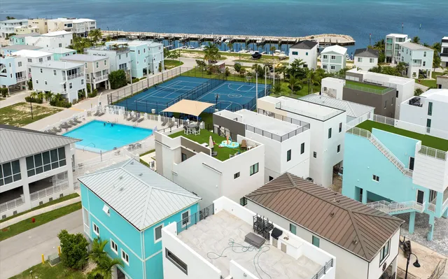 an aerial view of residential houses with outdoor space