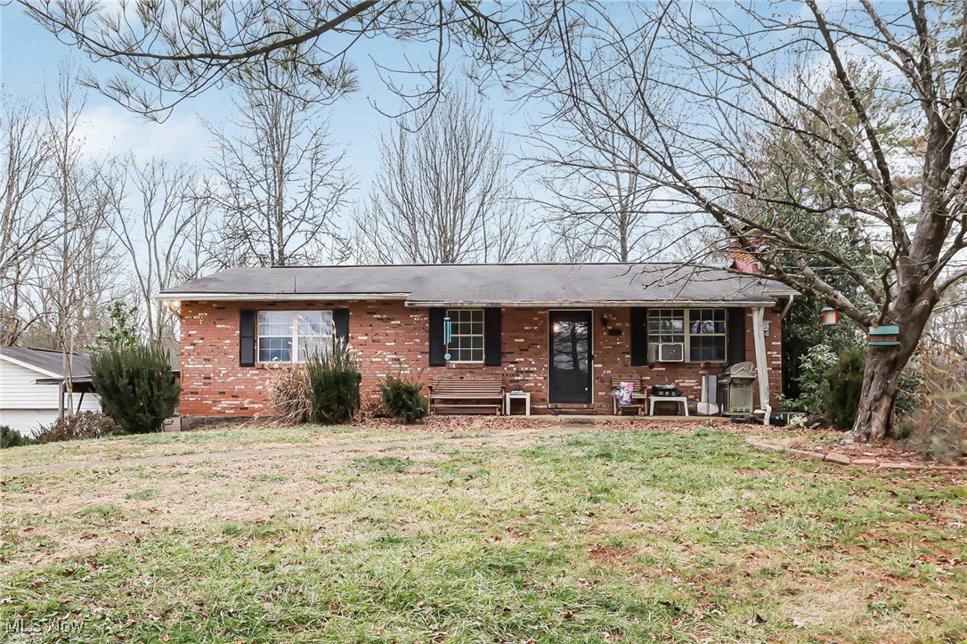 232 McGill Road Vincent, OH 45784 - Photo 1 of 49 Ranch-style home with brick siding, a front yard, and a porch