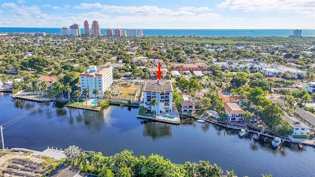 an aerial view of city and lake