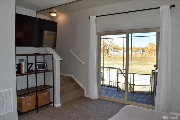 a view of entryway with wooden floor