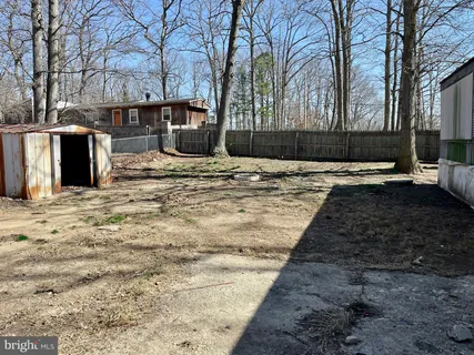 a view of a backyard with a barbeque