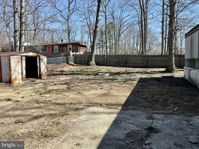 a view of a backyard with a barbeque