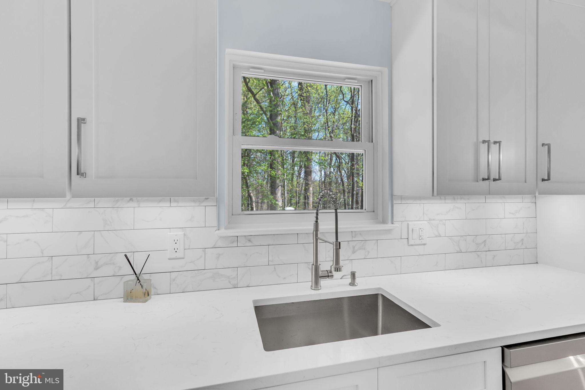 7804 Carrleigh Parkway Springfield, VA 22152 - Photo 18 of 61 a close view of sink and tap