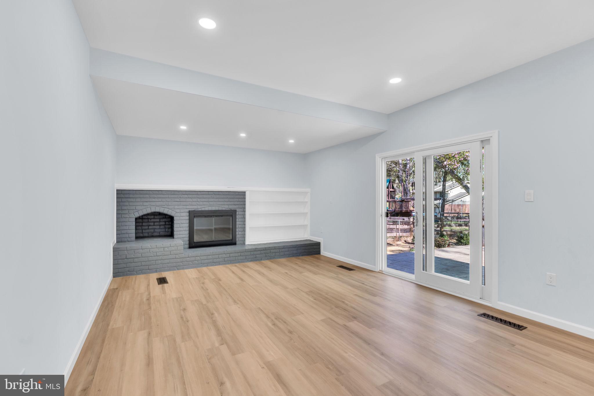 7804 Carrleigh Parkway Springfield, VA 22152 - Photo 22 of 61 an empty room with wooden floor and windows