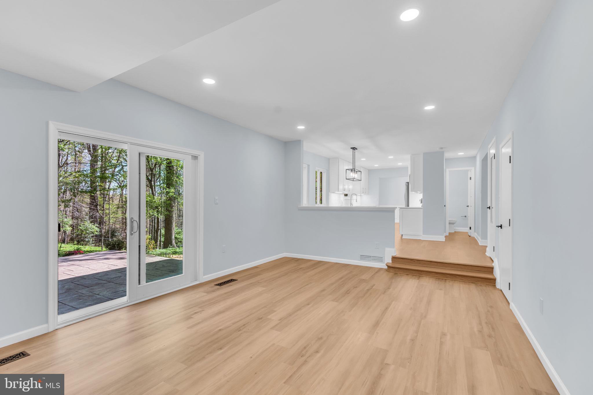 7804 Carrleigh Parkway Springfield, VA 22152 - Photo 24 of 61 a view of an empty room with wooden floor and a window