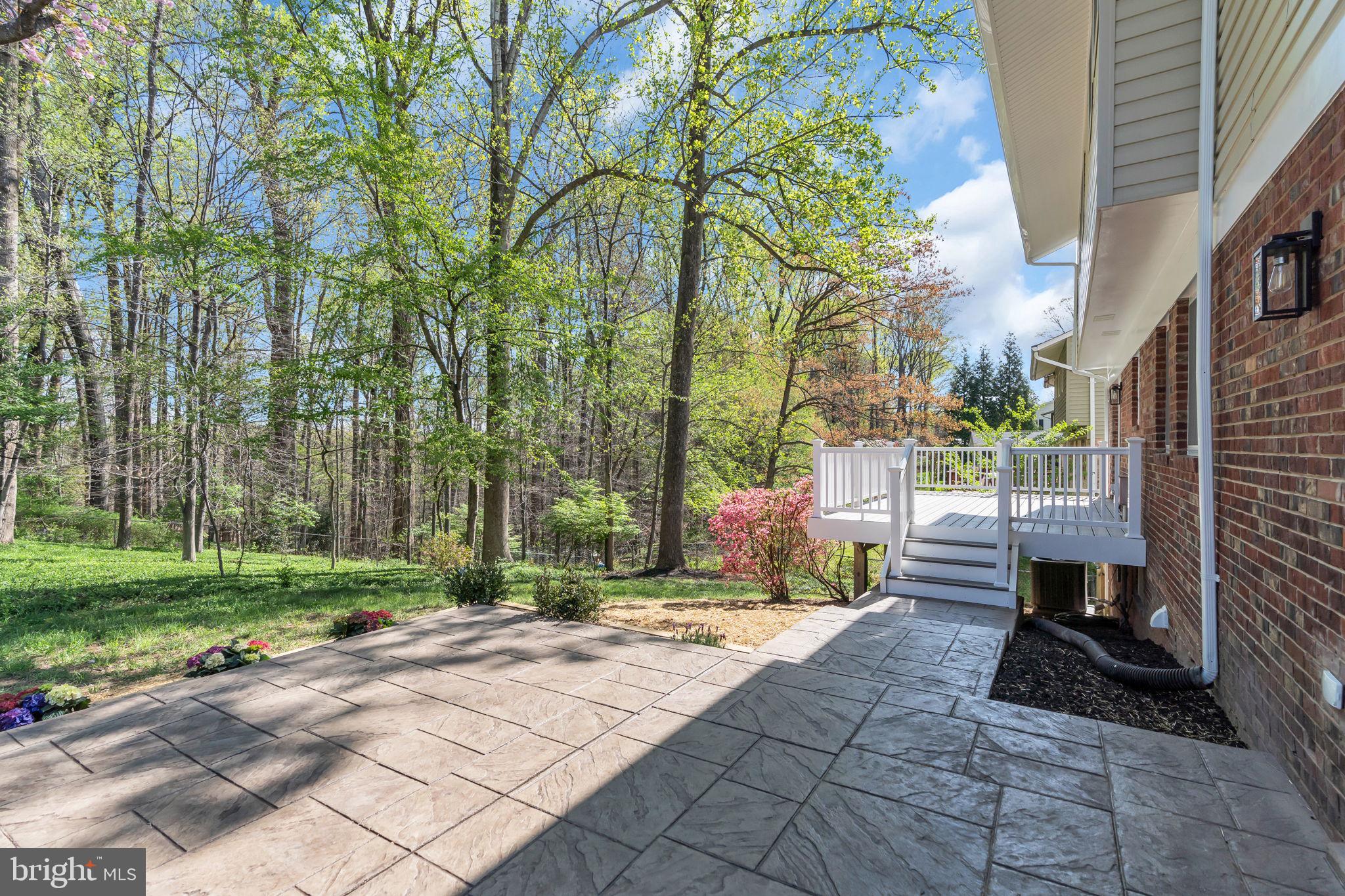 7804 Carrleigh Parkway Springfield, VA 22152 - Photo 27 of 61 a pathway of a house with a yard