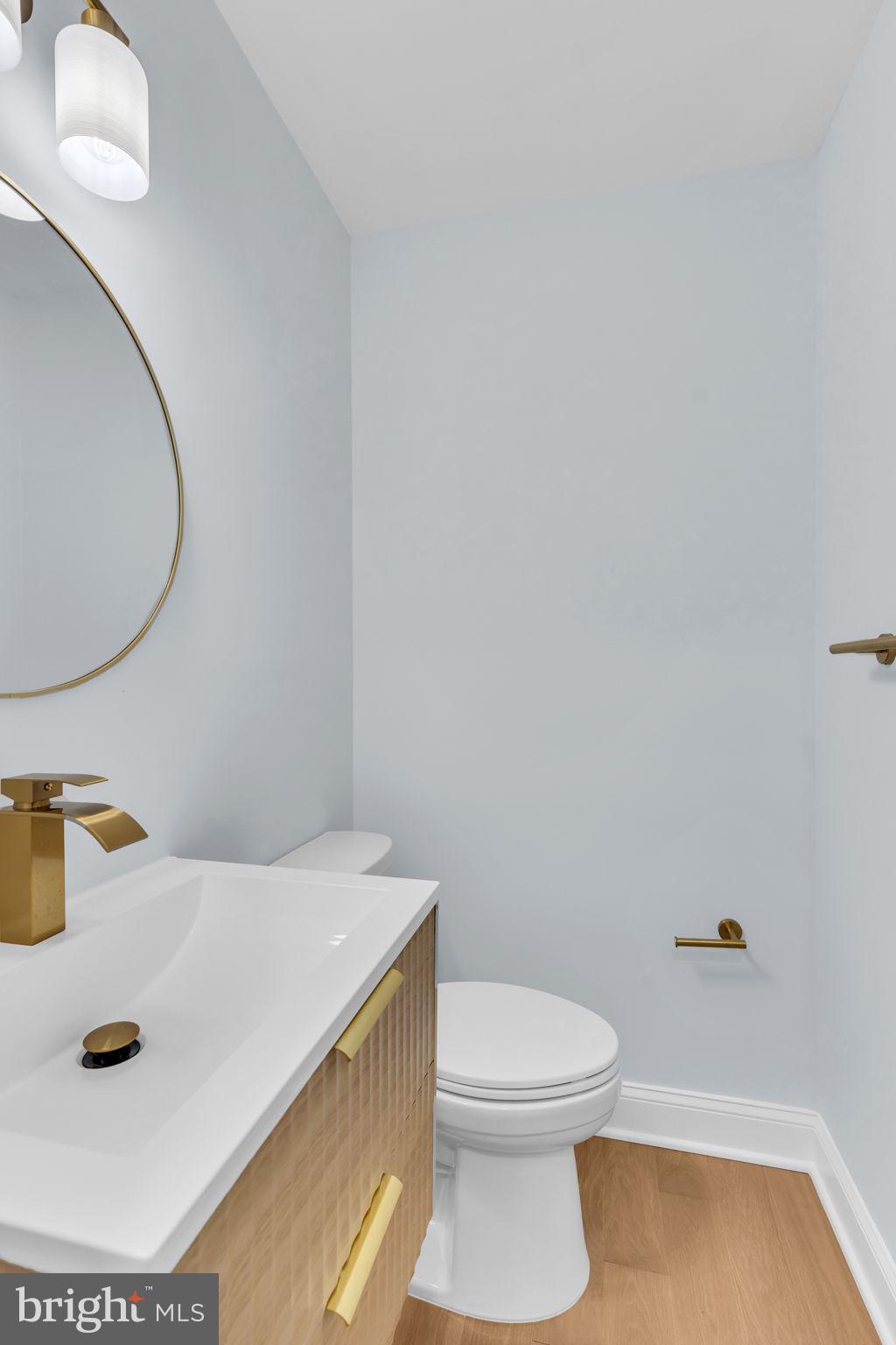 7804 Carrleigh Parkway Springfield, VA 22152 - Photo 28 of 61 a bathroom with a sink and a mirror