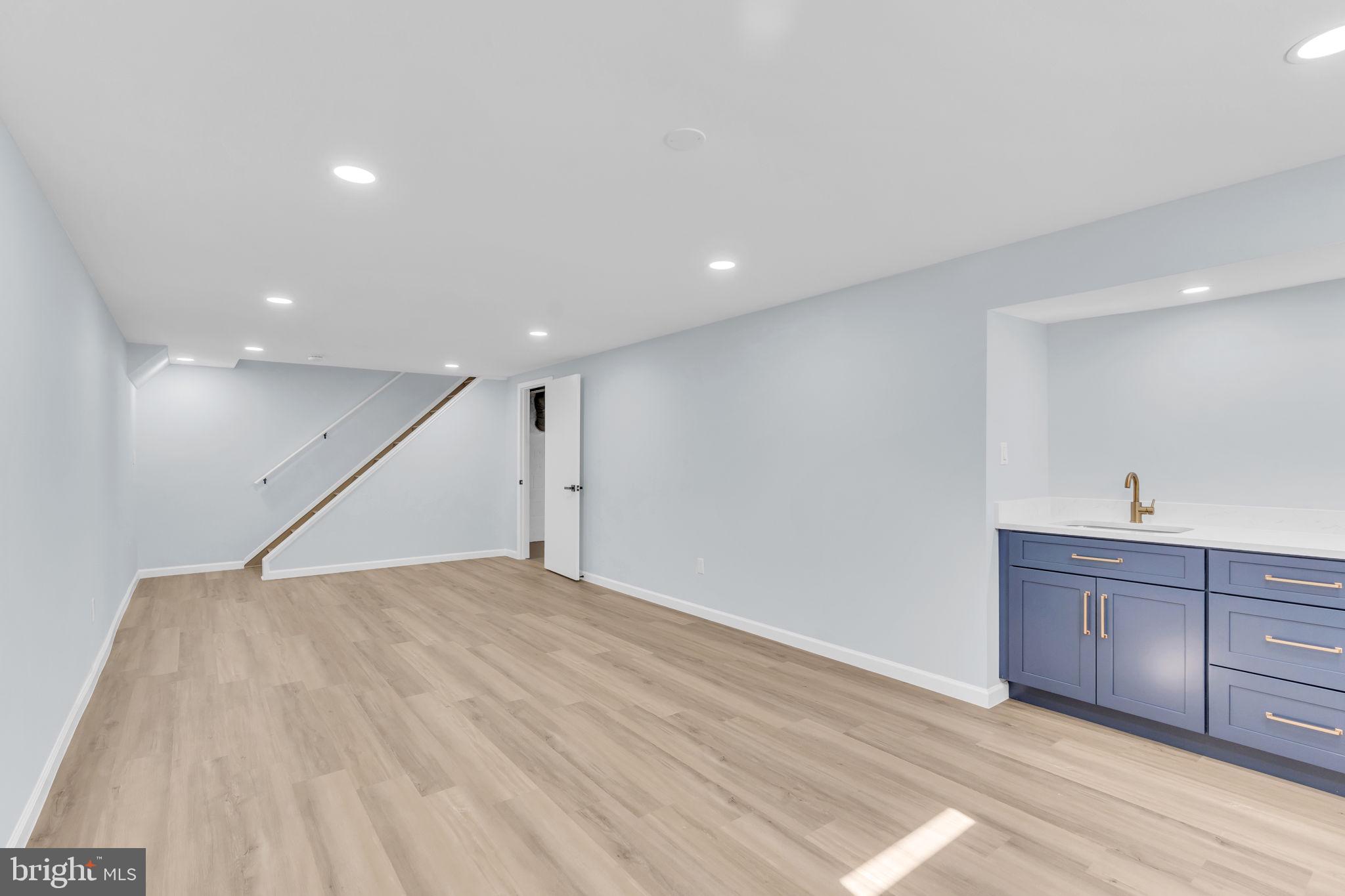 7804 Carrleigh Parkway Springfield, VA 22152 - Photo 49 of 61 a view of an empty room with wooden floor