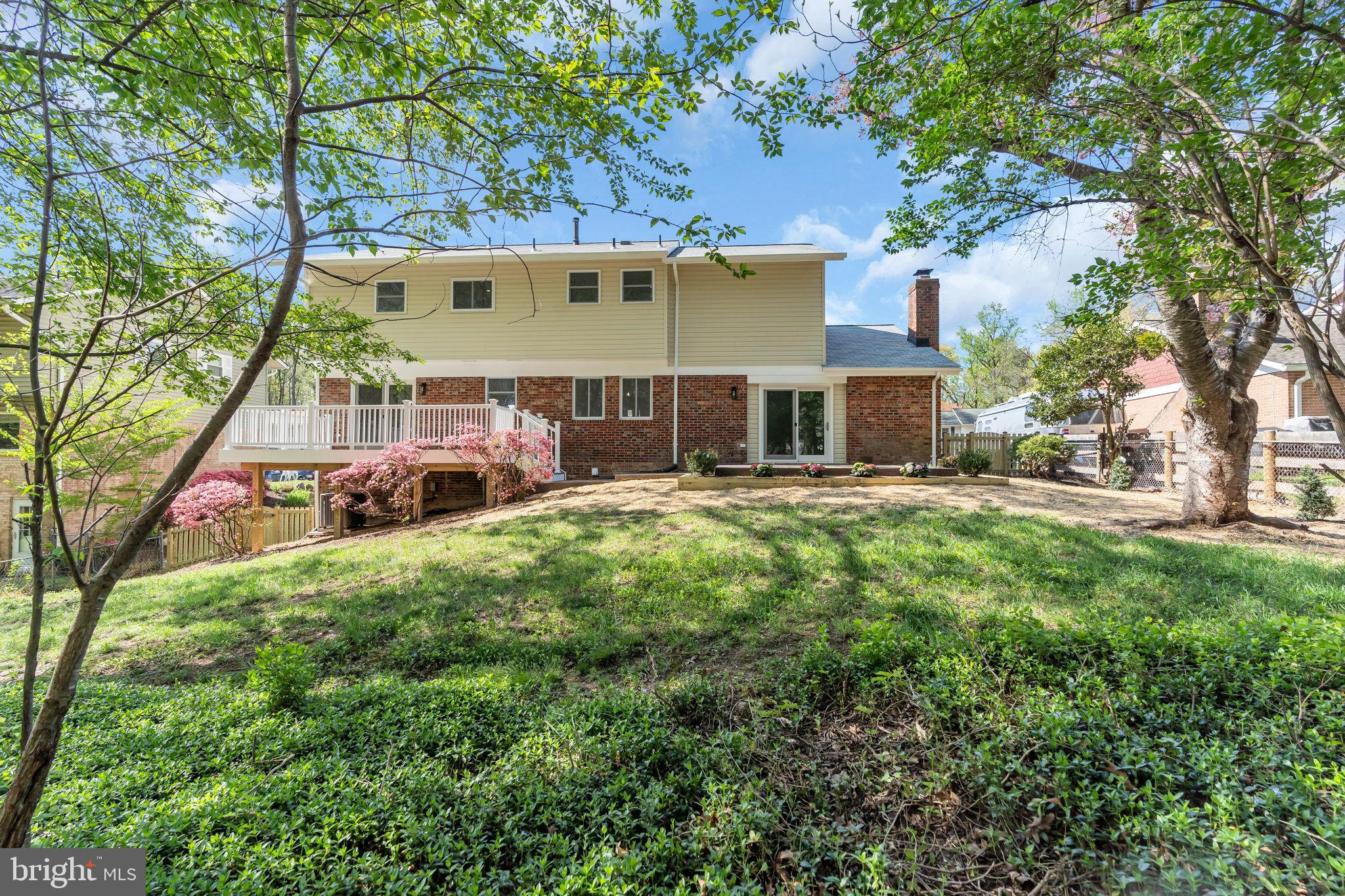 7804 Carrleigh Parkway Springfield, VA 22152 - Photo 55 of 61 a view of a house with a yard