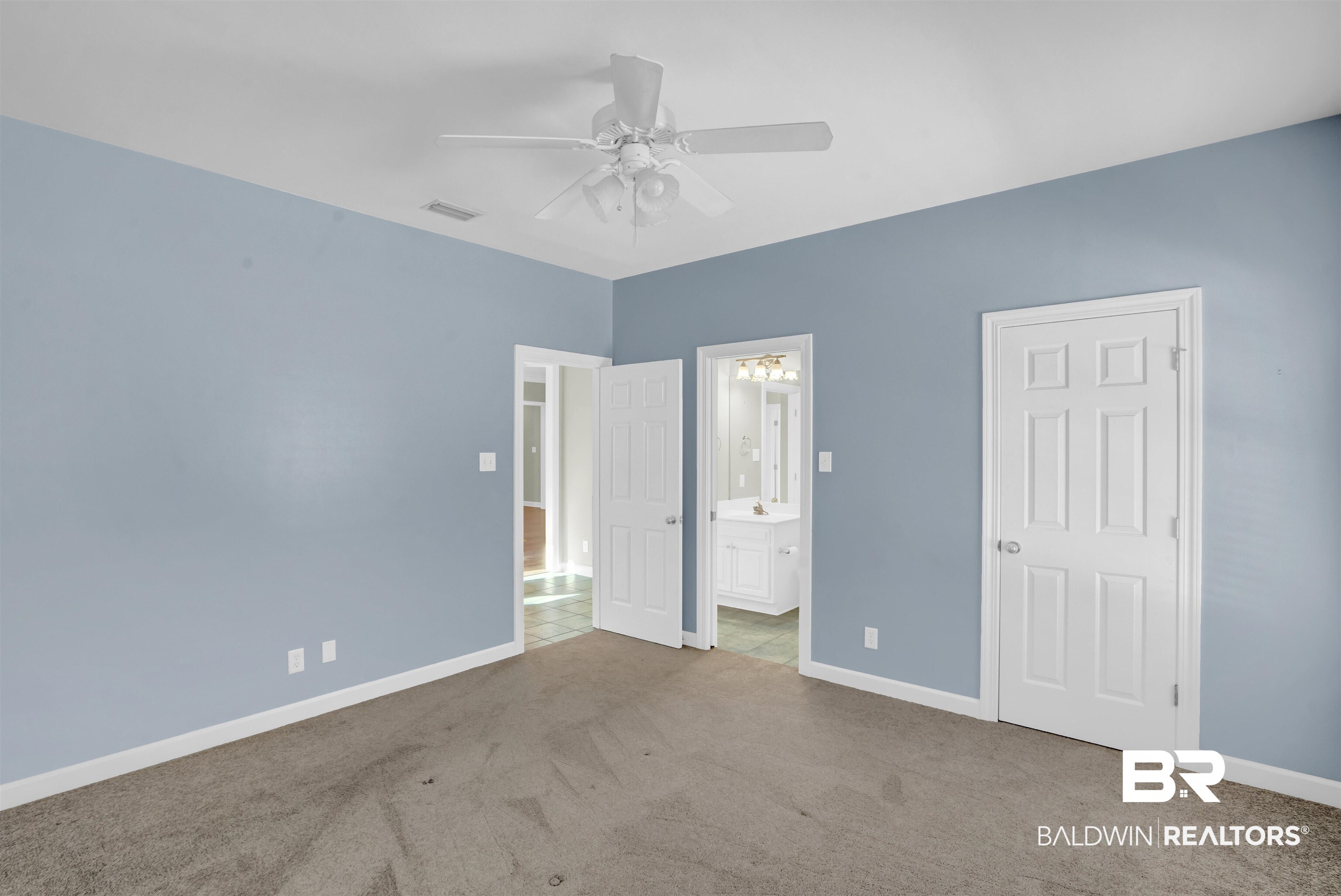 111 Beaver Dam Road Fairhope, AL 36532 - Photo 23 of 51 Unfurnished bedroom featuring ceiling fan, ensuite bath, and carpet flooring