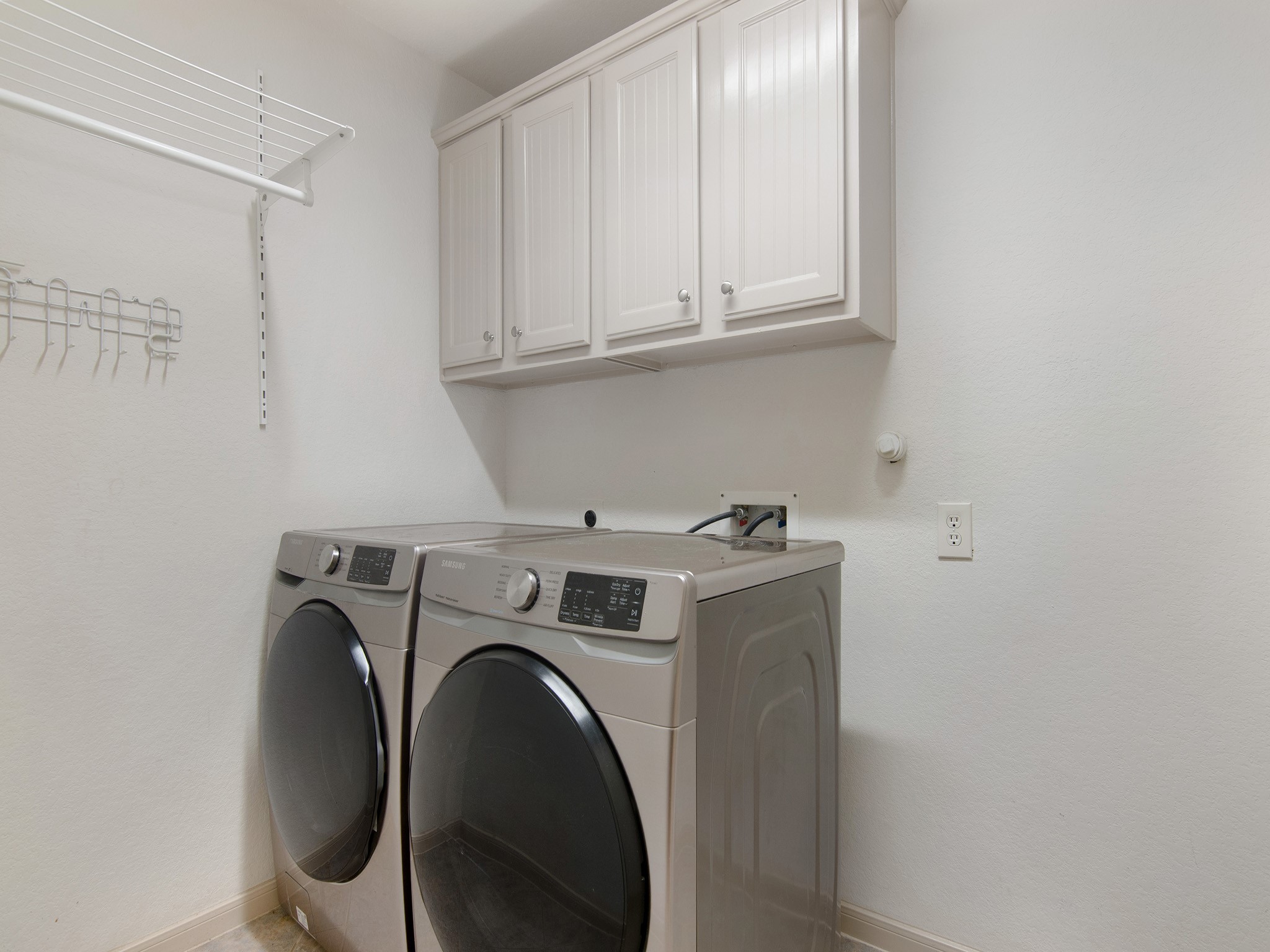 28323 Ryans Ridge Lane Spring, TX 77386 - Photo 22 of 45 Well placed laundry room with added storage, just steps away from the primary bedroom.