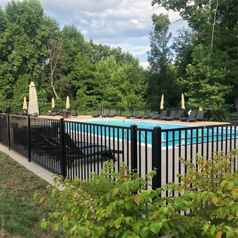 a room with chandelier and windows