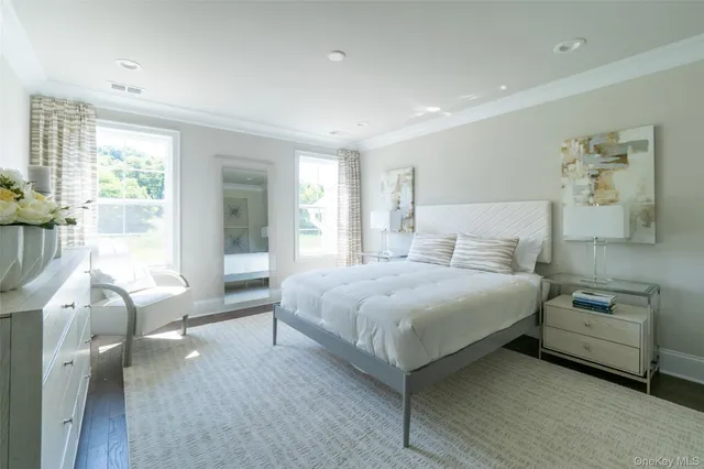 a spacious bathroom with a shower sink double and mirror