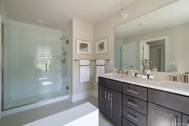 a bedroom with a bed table flowerpot and window
