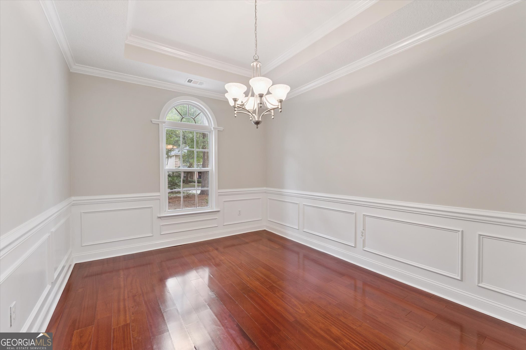 45 Veranda Trail Midway, GA 31320 - Photo 13 of 32 a view of an empty room with wooden floor and a window