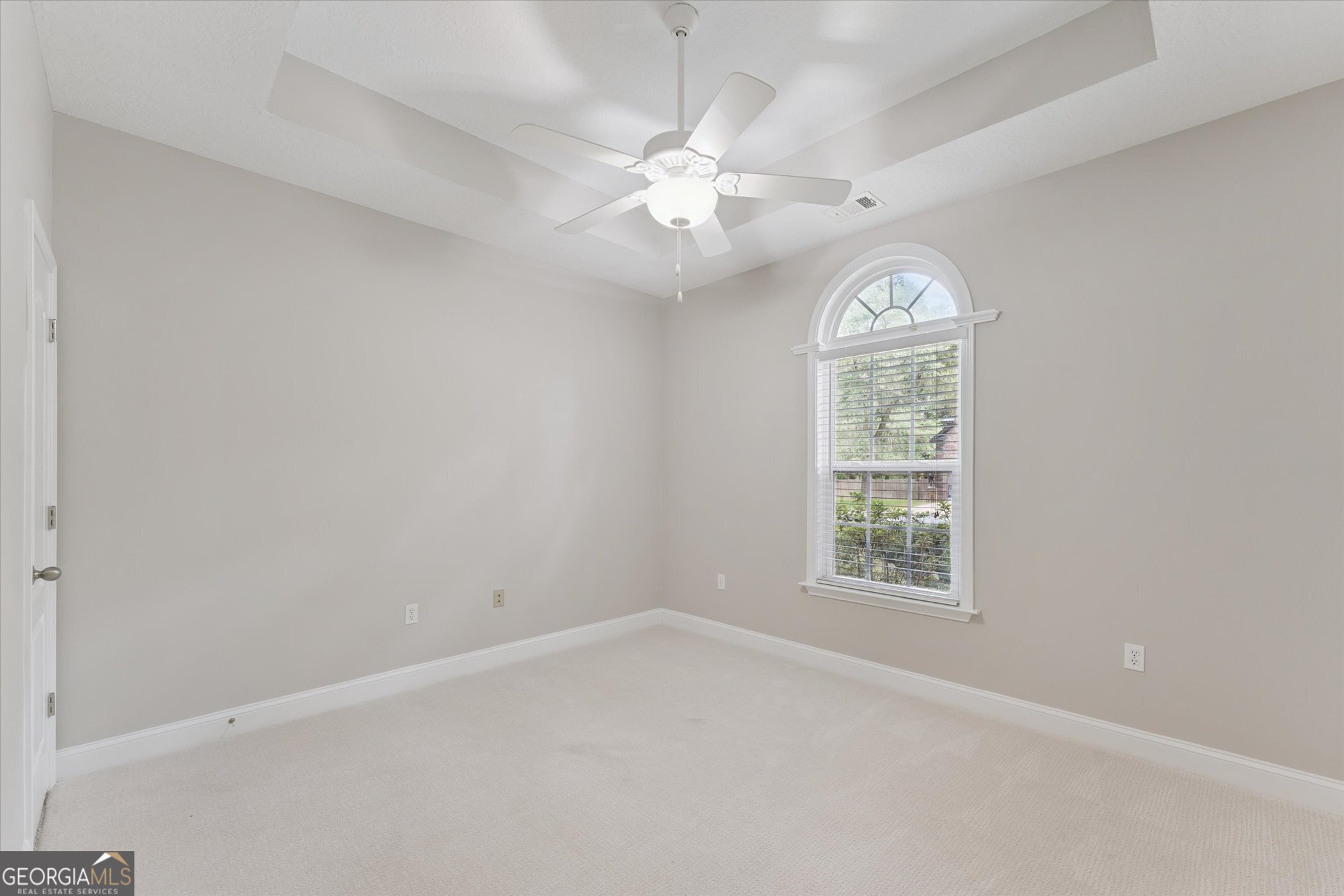 45 Veranda Trail Midway, GA 31320 - Photo 15 of 32 an empty room with windows and ceiling fan