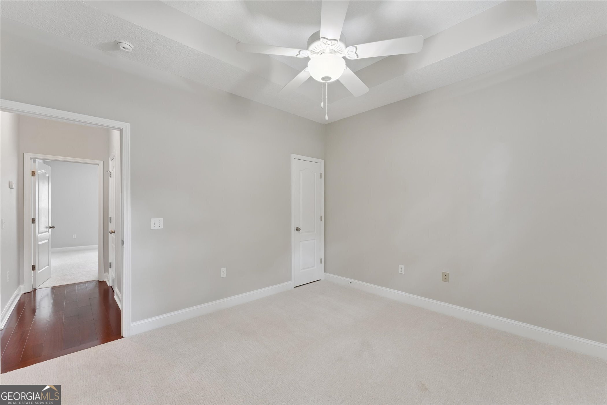 45 Veranda Trail Midway, GA 31320 - Photo 16 of 32 an empty room with a chandelier fan